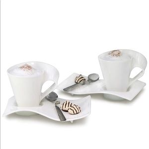 Set of two coffee mugs with dish and spoon